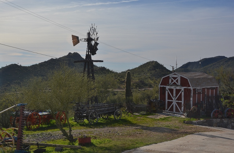 farm equipment and shed in yard